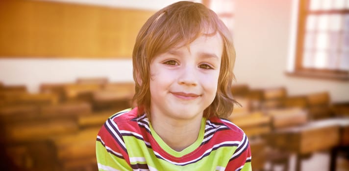 Happy little boy in the park against empty classroom