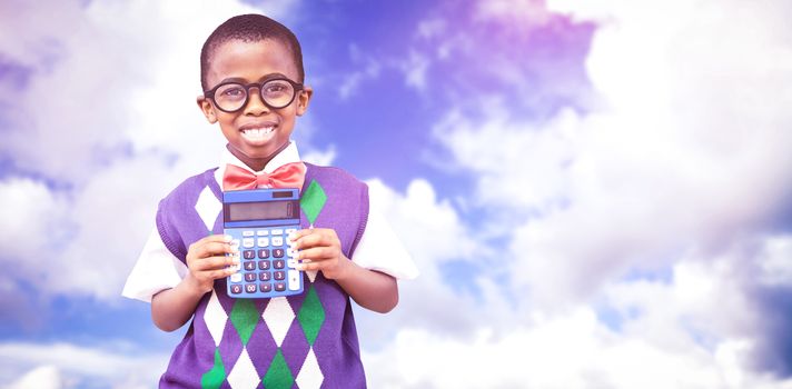 Happy pupil with calculator  against blue sky with white clouds