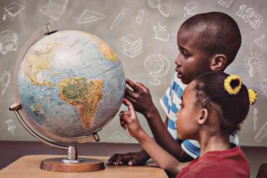 Education doodles against kids pointing at globe in classroom