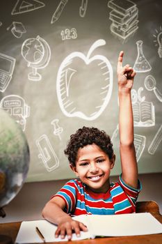 Education doodles against little boy raising hand in classroom