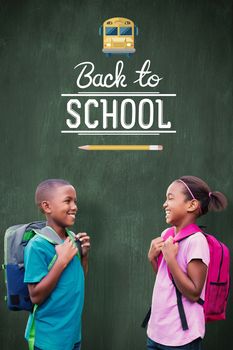 Smiling pupils against green chalkboard