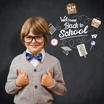 Cute pupil dressed up as teacher against blackboard