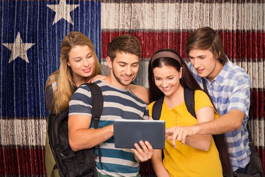 Students using digital tablet at college corridor against composite image of usa national flag