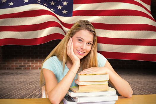 Portrait of female student in library against composite image of digitally generated united states national flag