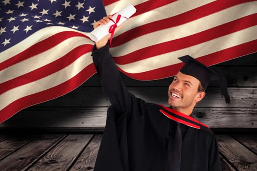 Happy attractive boy celebrating his graduation  against composite image of digitally generated united states national flag