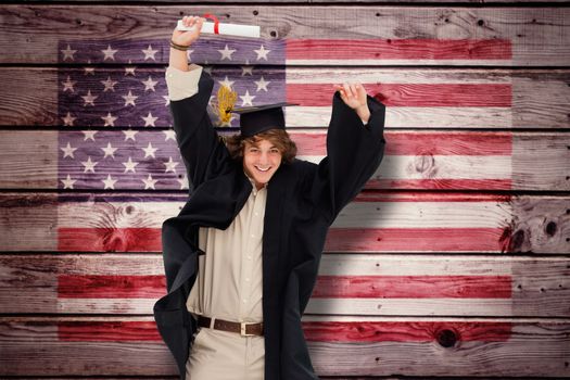 Male student in graduate robe jumping against composite image of usa national flag