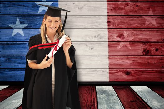 Woman smiling at her graduation  against composite image of usa national flag