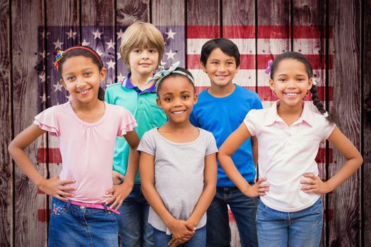 Cute pupils smiling at camera in classroom against composite image of usa national flag