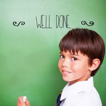 The word well-done! against cute pupil holding chalk