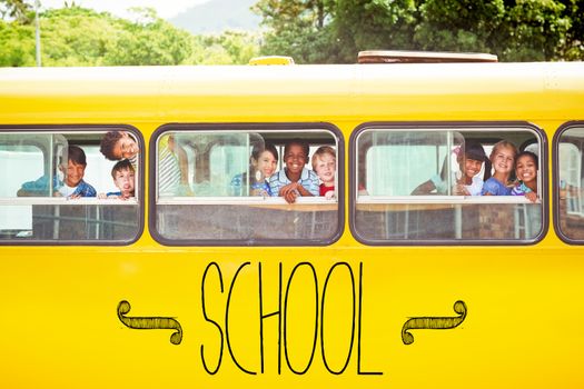 The word school against cute pupils smiling at camera in the school bus