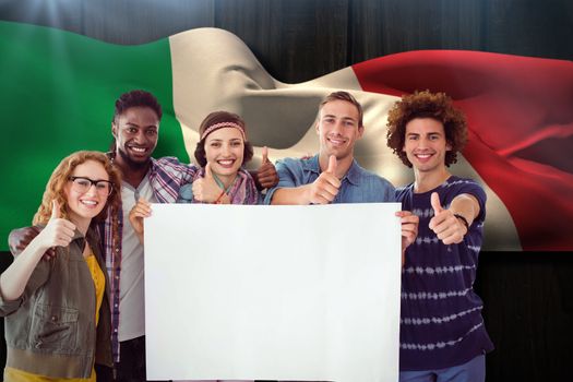 Fashion students smiling at camera together against italy flag waving