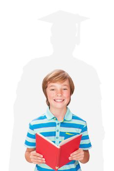 Cute pupil smiling at camera in library  against silhouette of graduate
