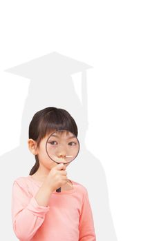 Pupil looking through magnifying glass against silhouette of graduate