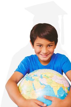 Pupil holding globe against silhouette of graduate