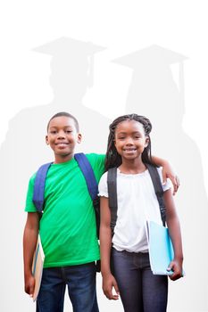 Cute pupils smiling at camera  against silhouette of graduate