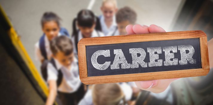 The word career and hand showing chalkboard against cute schoolchildren getting on school bus