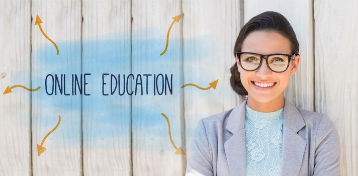 The word online education against stylish brunette thinking and smiling