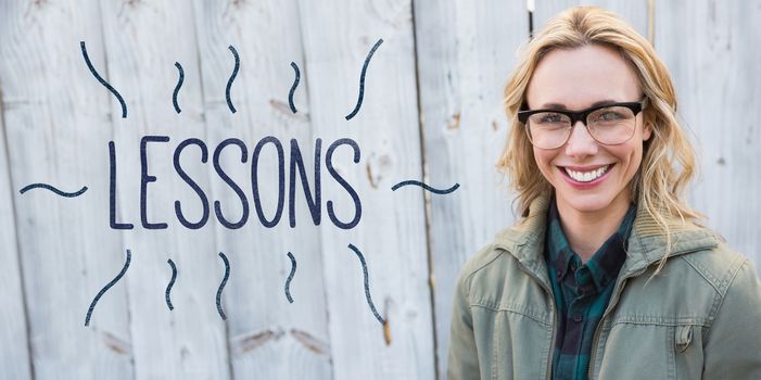 The word lessons against portrait of blonde in glasses posing