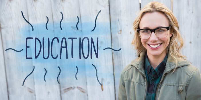 The word education against portrait of blonde in glasses posing