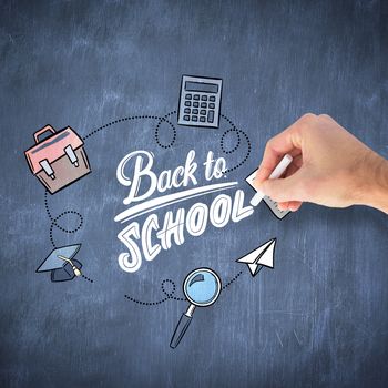 Hand writing with a white chalk against blue chalkboard