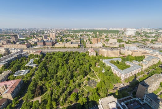 View of Moscow modern residential quarters at sunset on top of the roof of a tall building