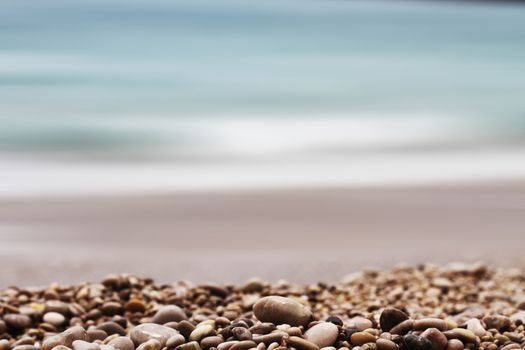 gravel depth of field with sea background theme 