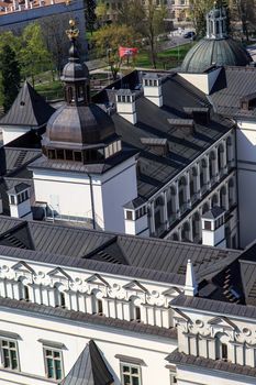 Close up detailed top view of historical architectural white building with black roof, in Vilnius, Lithuania.