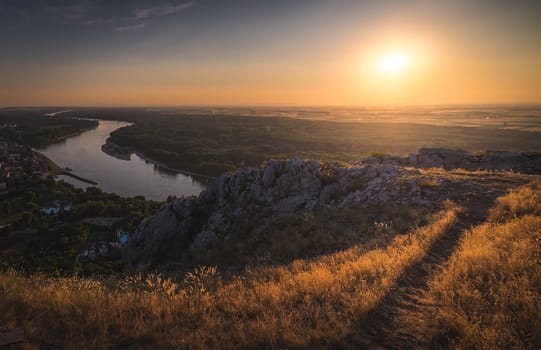 Landscape. Beautiful Sunset over the Rocks and the River