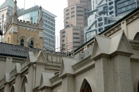 Miscellaneous types of architecture in Hong Kong. Traditional church and modern skyscrapers.