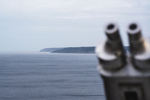 view of the Salento coast with binoculars