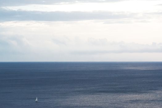 Sea and sky with sailboat in solitary