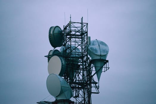 radio antenna tower with blue sky of evening twilight