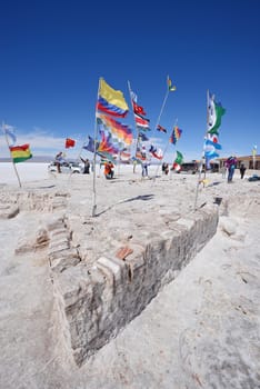 many national flags at a salt hotel in Uyuni, bolivia