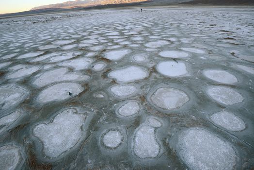 dried mud pattern at a salt flat basin at death valley national park