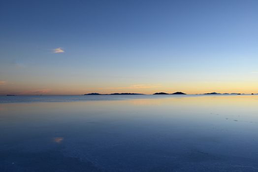 reflection over a pond in uyuni salt flat in bolivia