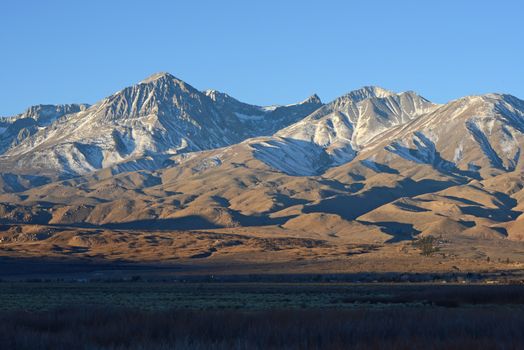 mountain landscape at sierra nevada range with grass hill