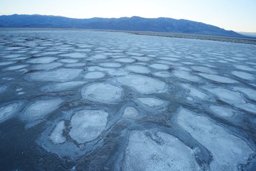 dried mud pattern at a salt flat basin at death valley national park