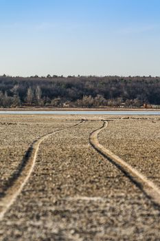 The road along the bottom of the dried lake