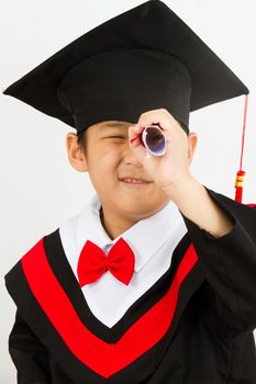 Chinese little boy graduation in white backround studio shot.