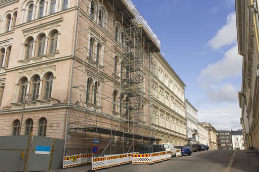 Street with building under construction and cars.







Building under Construction