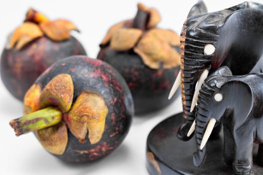 mangosteen with sculpture of elephants