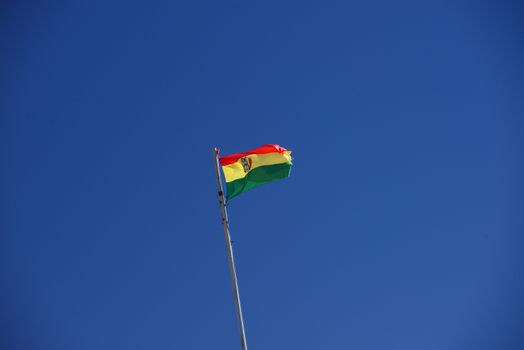 bolivia flag with a blue sky