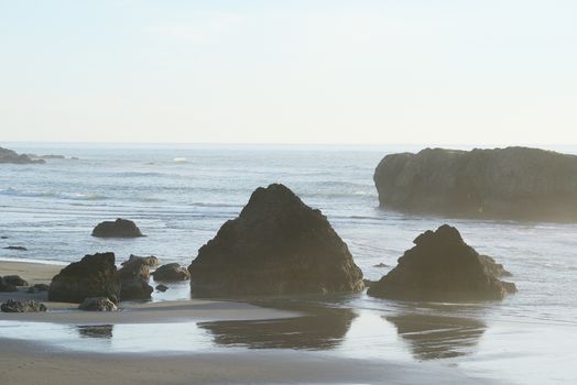 sea rock at southern oregon beach at the late afternoon