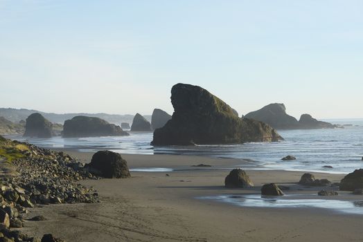 sea rock at southern oregon beach at the late afternoon