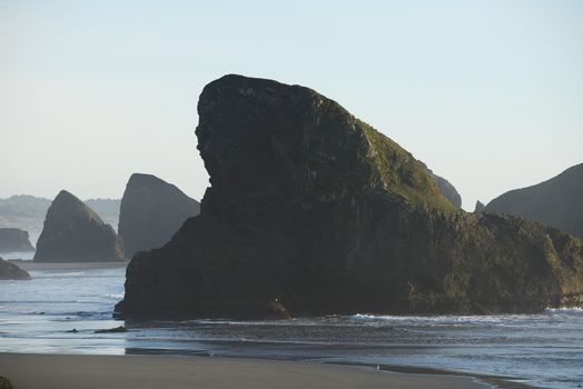 sea rock at southern oregon beach at the late afternoon