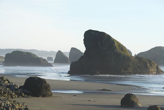 sea rock at southern oregon beach at the late afternoon