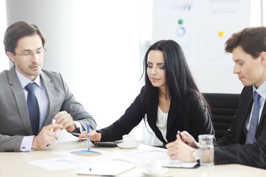 Business people discussing financial reports during a meeting