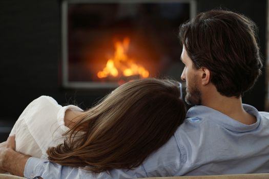 young couple next to the fireplace