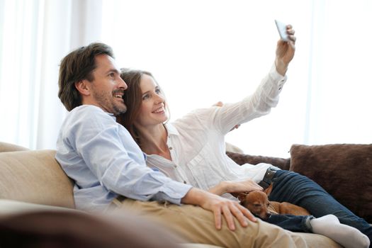 happy young couple making selfie