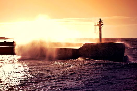 Coast and nature. Sunset over storm on the sea. 